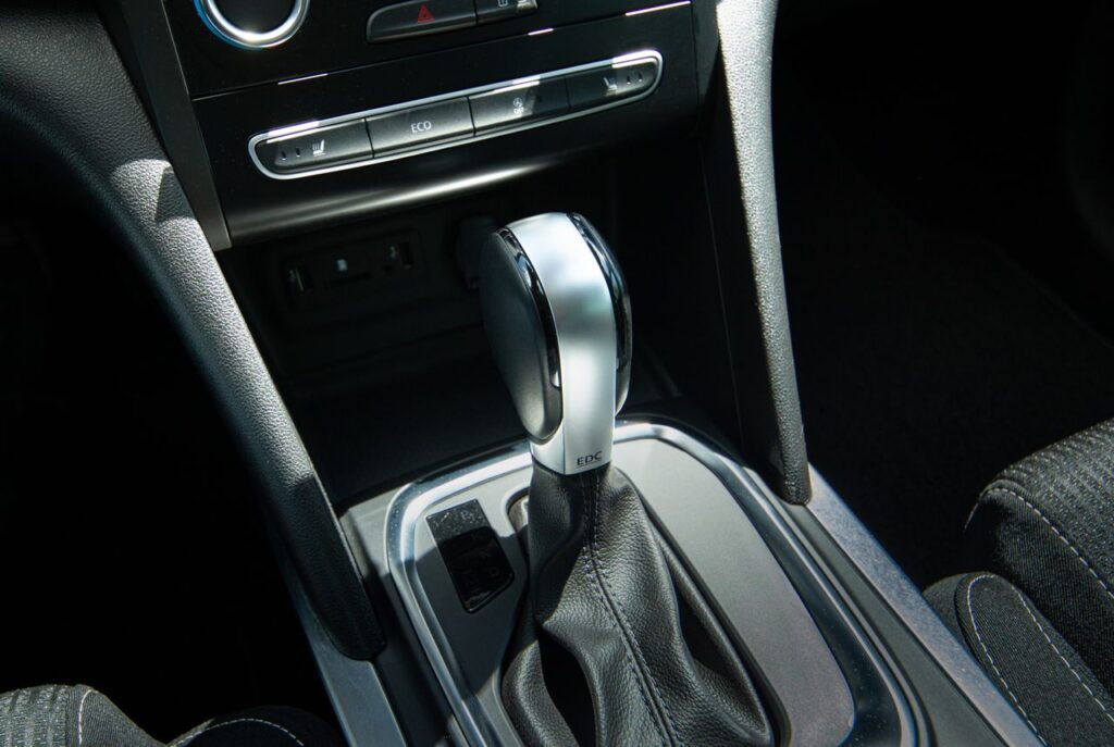 Crafting Captivating Headlines: Your awesome post title goes here Detail view of a modern car gear shift lever and console interior design.