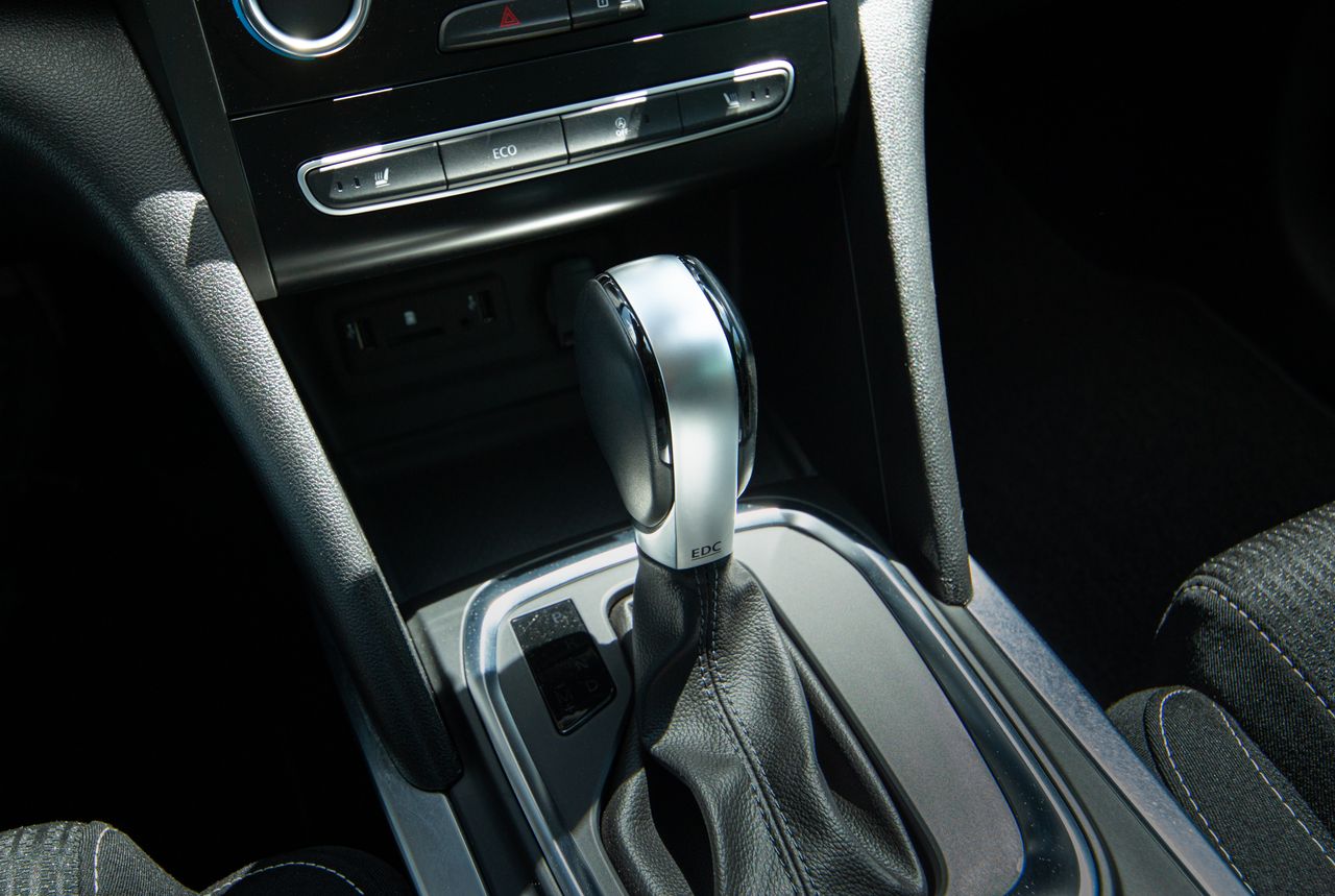 Crafting Captivating Headlines: Your awesome post title goes here Detail view of a modern car gear shift lever and console interior design.